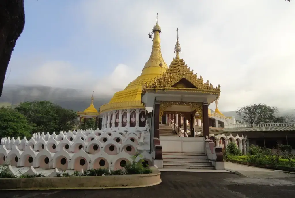 Goenka Vipassana meditation centre: a golden pagoda surrounded by individual meditation cells in India